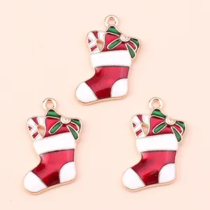 Three festive Christmas stocking charms made of alloy enamel for DIY jewelry making