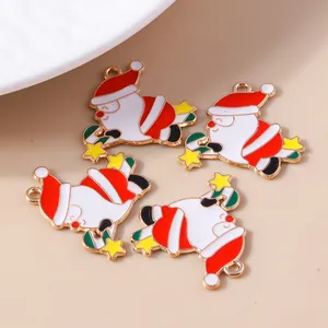 Detail of four cartoon Santa Claus enamel charms with golden rings for DIY jewelry making