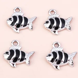 Detail of silver alloy fish charms with black drip oil stripes for DIY jewelry making