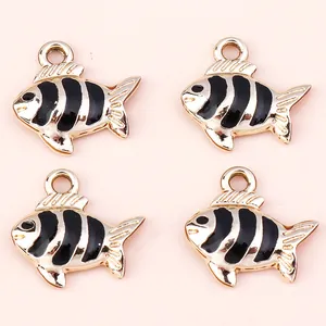 Pack of golden fish charms with black enamel stripes for DIY jewelry making