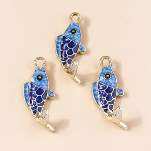 Three blue koi fish charms with gold plating and enamel scales for jewelry making