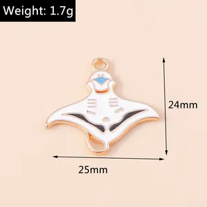 Detail of white enamel manta ray pendant with gold trim, size 24mm x 25mm, weight 1.7g