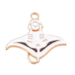 Detailed view of manta ray enamel pendant charm with gold edges and white drip oil