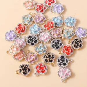 Detailed macro shot of multi-colored enamel rose pendants with sparkling rhinestone inlay
