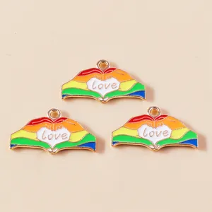 Detail of alloy heart gesture pendants with rainbow oil drips and love engraving