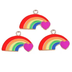 Golden alloy rainbow charms with heart detail and enamel finish for DIY jewelry making