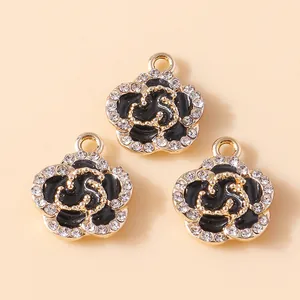 Close-up of black enamel rose flower charms with crystals for DIY jewelry making