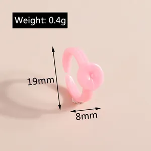 Pink resin flower ring dimensions 19mm height with 8mm floral detail and 0.4g weight