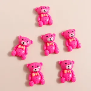 Détails d'ours en résine rose avec nœuds orange pour bricolage de coques de téléphone