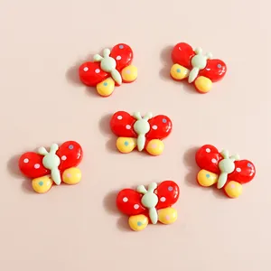 Set of 6 colorful resin butterfly charms with polka dots for DIY phone case crafts