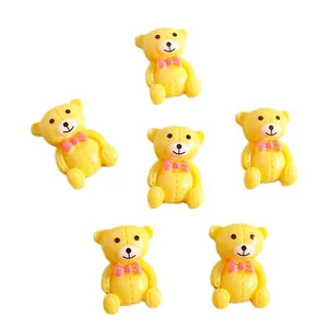 Lot de 6 mignons ours en résine jaune avec nœuds roses pour décoration de coques et DIY