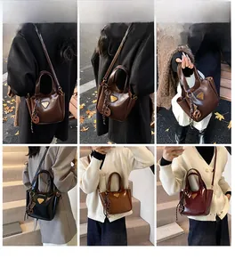 Fashion bucket bag detail showing models styling four colors with triangular metal plaque