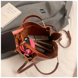 Top view of large brown bucket bag showing spacious interior with daily essentials