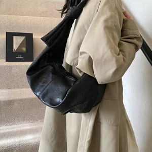 Large black pleated leather shoulder bag with decorative knot strap for casual wear