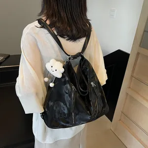 Retro black faux leather tote bag for women with a cute white cloud charm in a casual style