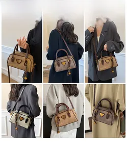 Detail showing vintage Boston bag with gold triangle logo and various color options