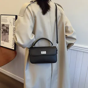 Classic black leather crossbody bag for women with silver square lock and top handle