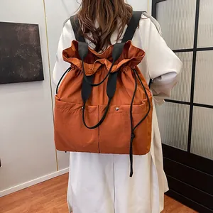 Caramel orange drawstring backpack tote with large pockets and high capacity for women