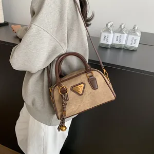 Retro camel suede bowling handbag with brown leather trim and golden hardware