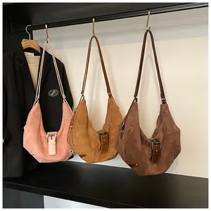 Detailed comparison of vintage suede hobo bags in pink, camel, and dark brown colors
