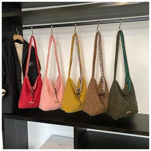 Detail of colorful fuzzy tote bags showing plush texture and checkered canvas lining