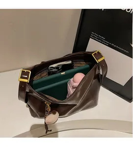 Top view of large brown faux leather tote bag interior showing ample storage space