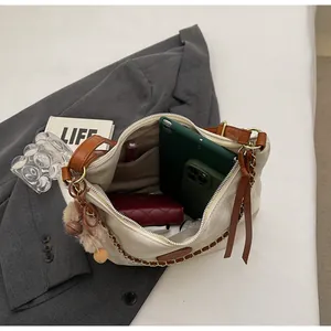 Detailed top view of off-white tote bag interior showing large capacity for essentials