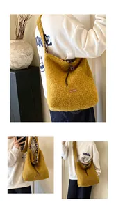 Detail of ginger yellow plush tote bag showing fuzzy lamb wool texture and faux leather tag