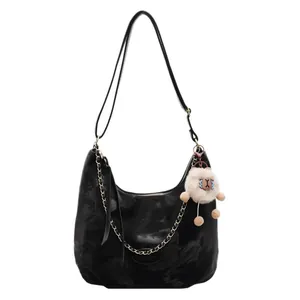 Black velvet hobo tote bag with chain strap and cute plush doll pendant accessory