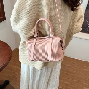 Pink pleated hobo bucket bag with top handle and golden hardware for women fashion