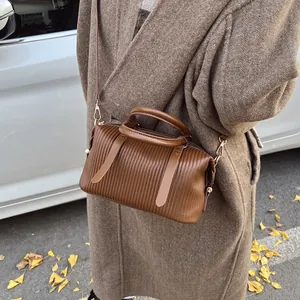 Retro brown pleated leather boston bag for women with gold hardware and shoulder strap