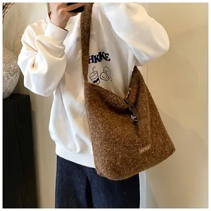 Detail view of large brown plush tote bag showing soft texture and our fave fabric label