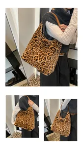 Detail view of large leopard print faux fur tote bag showing texture and shoulder strap