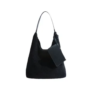 Black faux shearling tote bag with leather strap and detachable small pouch