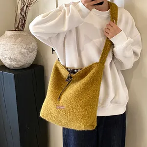 Chic mustard yellow plush tote bag with drawstring closure and soft textured fabric