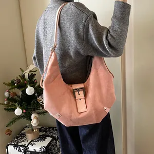 Vintage pink suede hobo bag for women with large capacity and buckle detail on shoulder strap