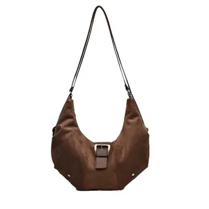 Retro dark brown suede hobo bag with adjustable leather strap and silver buckle detail