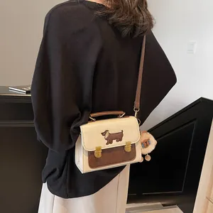 Retro contrast crossbody bag with dachshund embroidery and sheep plush charm on model
