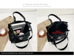 Detailed interior of black canvas tote showing large capacity and metal lock closure