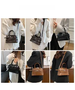 Detail view of retro Boston-style handbags in dark brown, black, and caramel leather