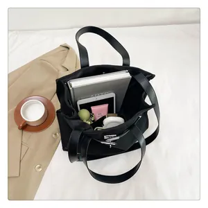 Top view of spacious canvas tote bag showing interior storage for tablets and books