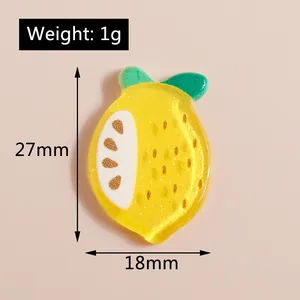 Detailed view of resin lemon charms with glitter, size 27mm x 18mm for DIY crafts