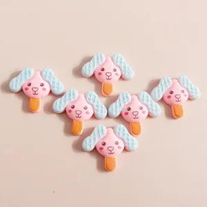 DIY resin accessories featuring cute pink dog ice cream popsicle designs for hair clips