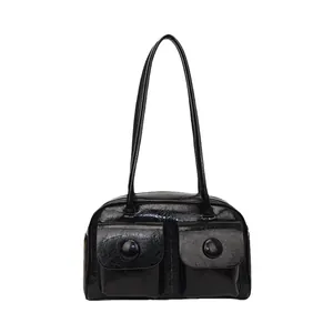 Glossy black patent leather shoulder bag with multi-pocket design and retro style