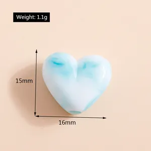 Détail d'une perle coeur marbrée bleue 15x16mm avec dimensions précises et poids indiqués