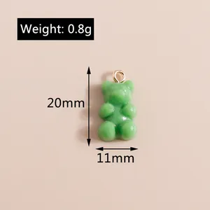 Detailed view of green resin bear pendant with dimensions 20x11mm and 0.8g weight