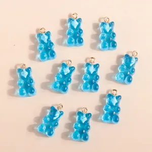 Blue translucent resin gummy bear pendants with golden rings for DIY jewelry