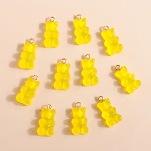 Set of yellow resin gummy bear charms with golden loops for DIY jewelry making