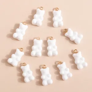 Set of 11 white resin gummy bear charms with gold metal loops for DIY jewelry making