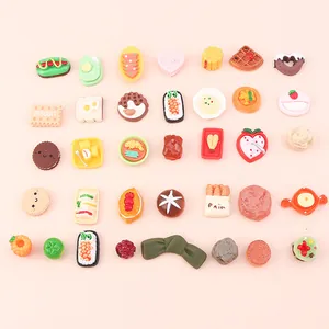 Assorted miniature resin food charms for DIY crafts like biscuits donuts and sushi